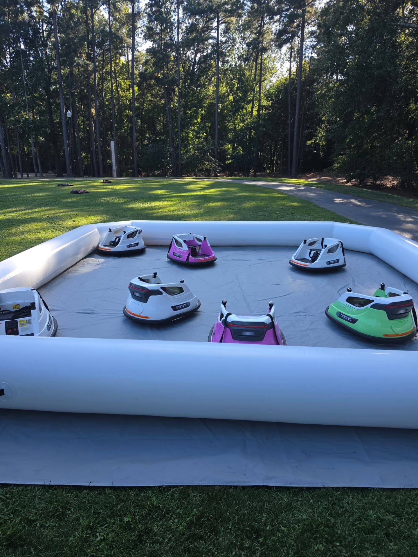 Bumper car arena set up on park grass before Irmo National Night Out