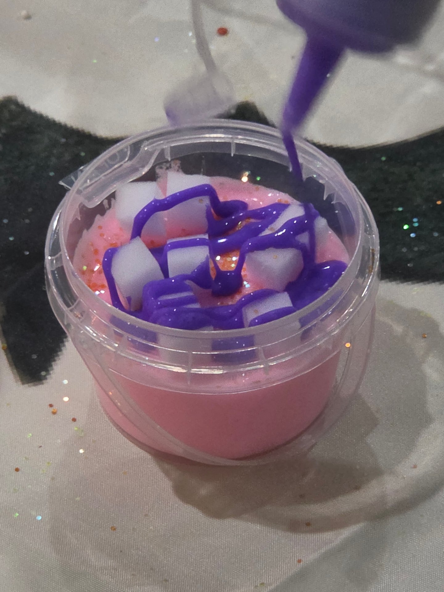 Pink slime drizzle being added to a cup
