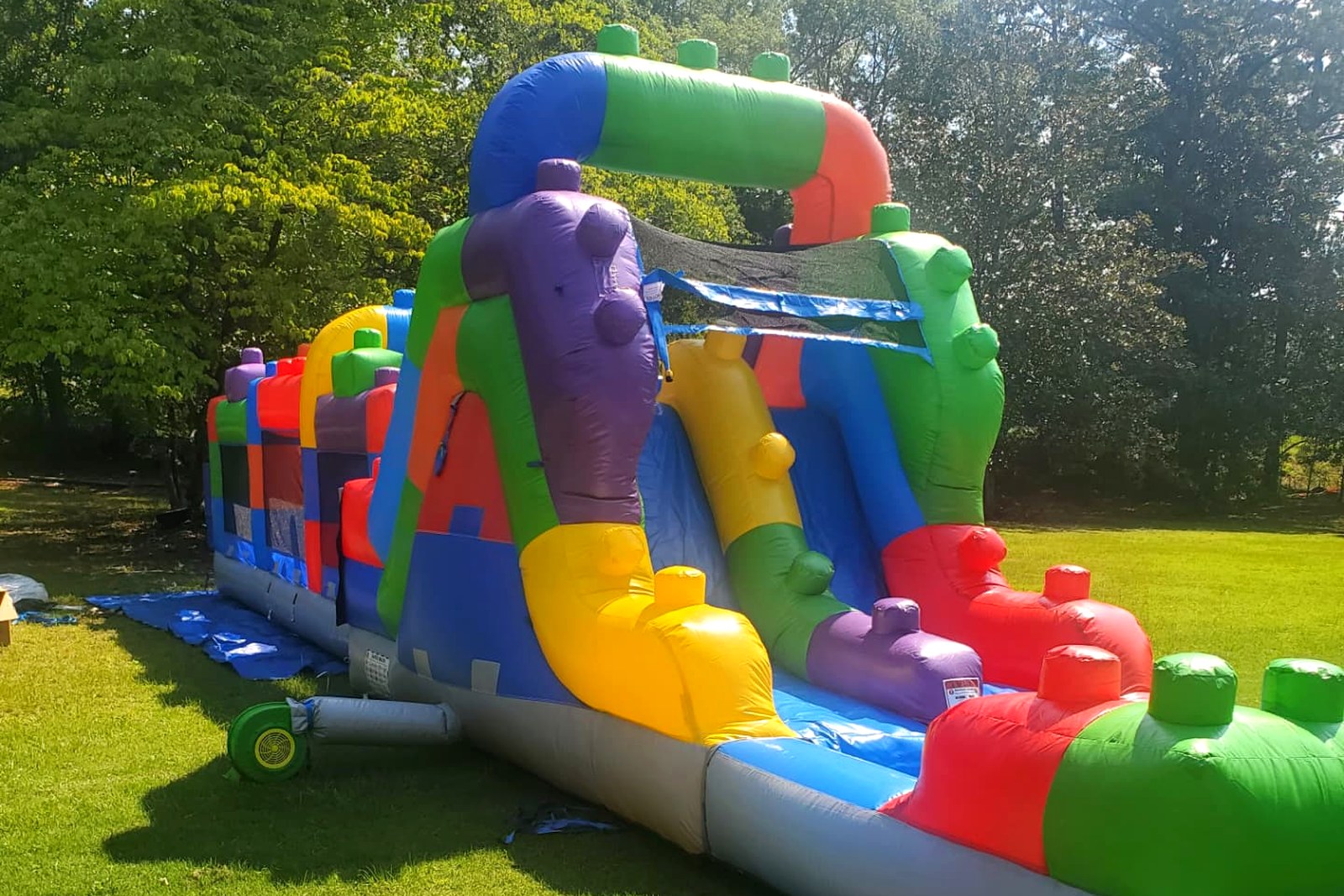 Building block obstacle course section next to the Carolina Double Drop dual lane slide