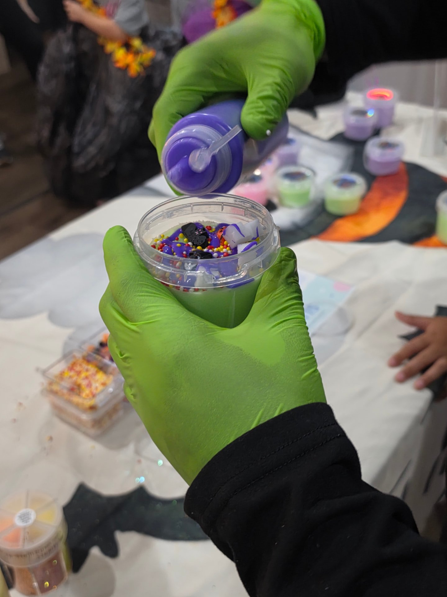 A finished slime cup with colorful toppings from our Lexington pop-up