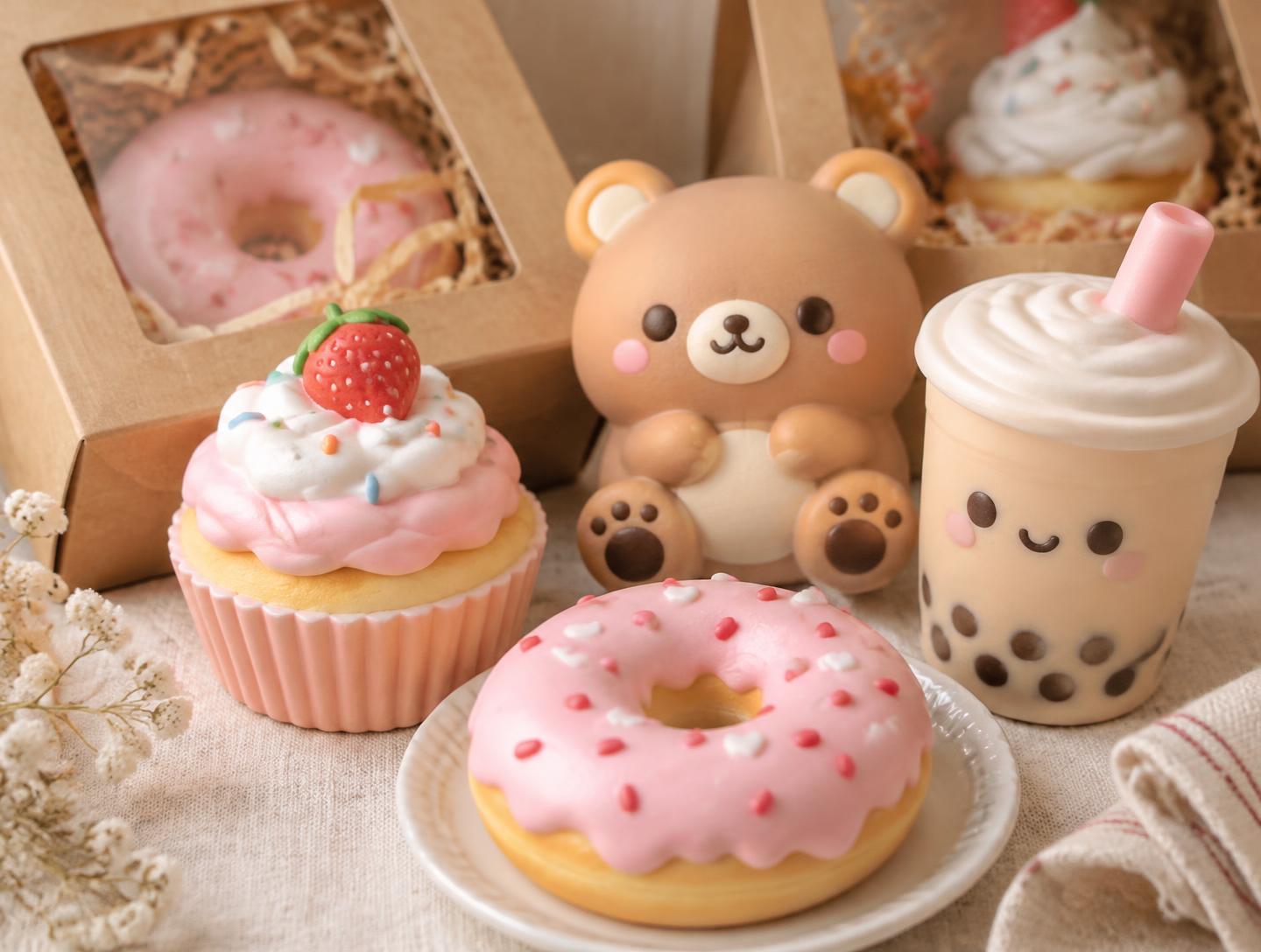Styled example of finished squishies beside bakery boxes with clear windows